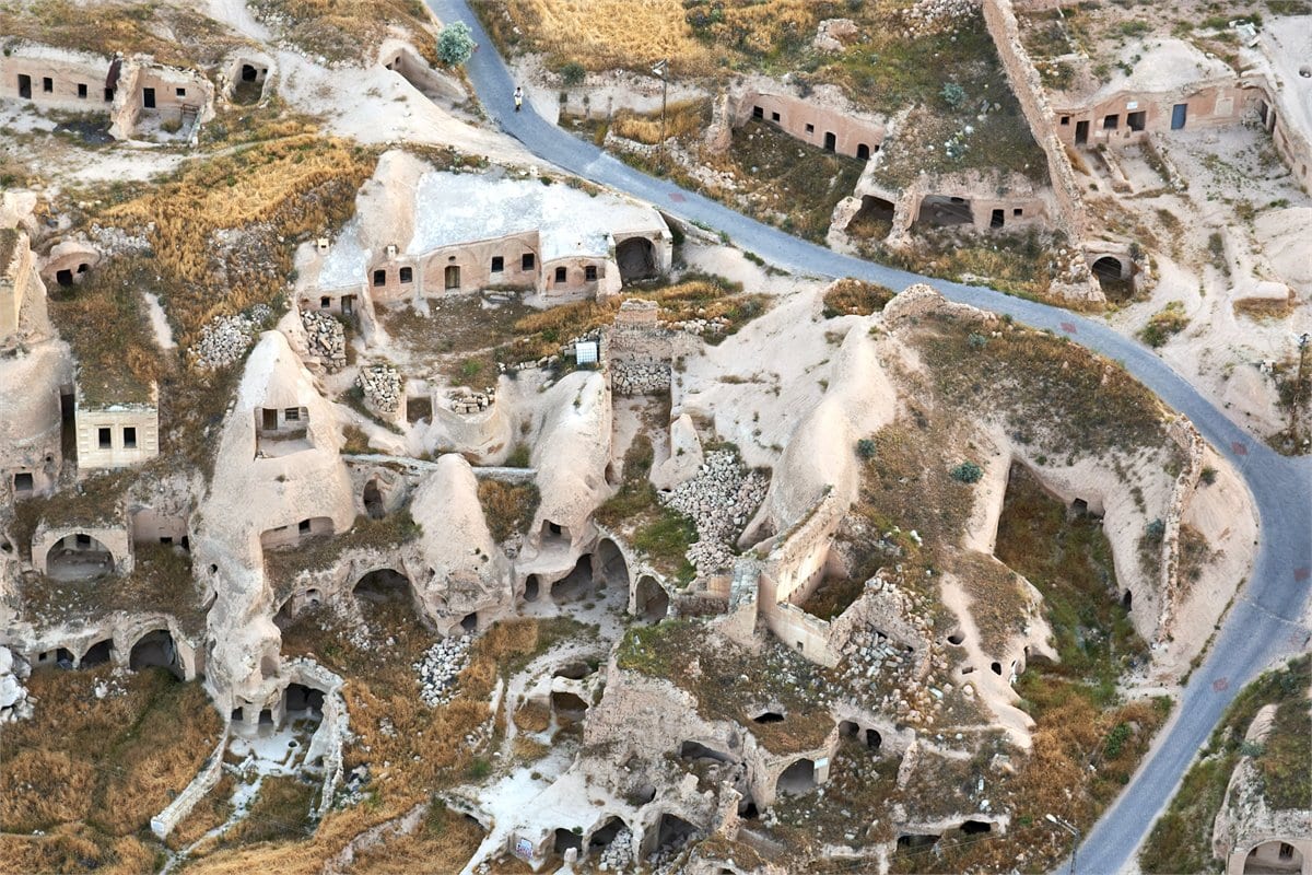 Aerial view of rock-cut cave dwellings carved into the tuff hillsides of Cappadocia